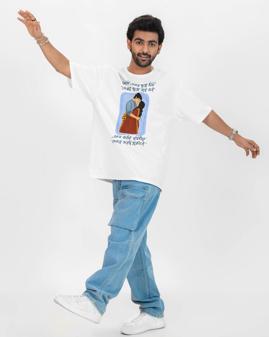 A man modeling a white Bengali graphic t-shirt with blue jeans and white sneakers, posing against a solid white studio background.