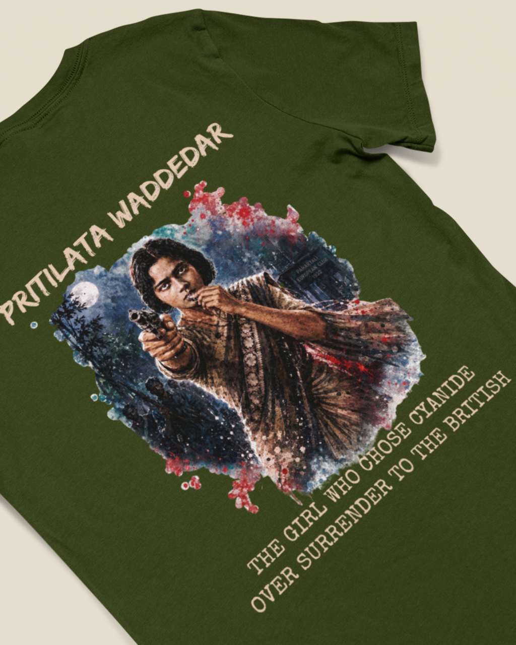 An olive green short-sleeve t-shirt with a large graphic print on the back, featuring a portrait of Queen Victoria with the text 'PRITILATA WADDEDAR' and 'THE GIRL WHO MOST STANDS OVER SUERRENDER TO HER BRITISH'.